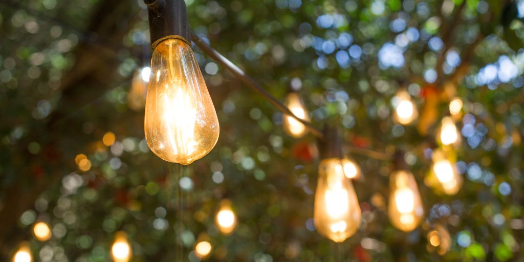 Festoon lights hanging in trees are a popular idea for outdoor lights