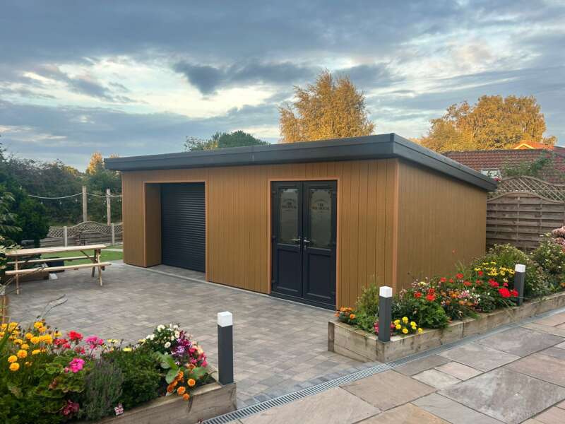 Cedar Classic Woodgrain Composite Cladding On A Garden Room - Assured Composite